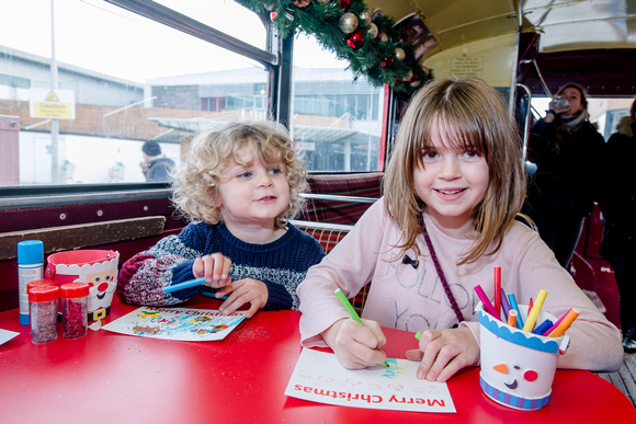 Father Christmas and his elves visited the Orbital Shopping centre on a double decker bus at the weekend .