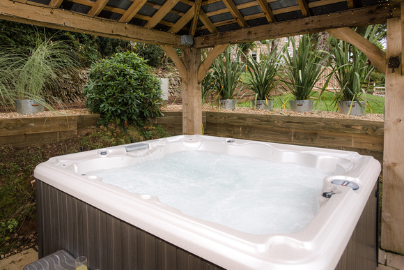 Lisa and Peter Earnshaw at their property in Devon, Little Silver Nugget, for which they have received the Sykes Gem Award for award for ‘Best Hot Tub Property’.